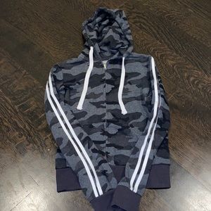 camo zip up with white stripes on the sleeves